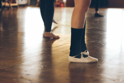 Low section of people standing on floor