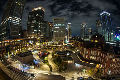 High angle view of illuminated buildings in city at night