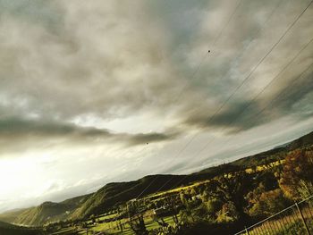 Scenic view of landscape against sky at sunset