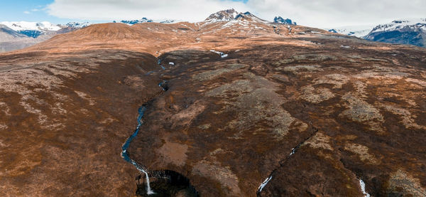 Aerial view of the svartifoss waterfall surrounded by basalt columns