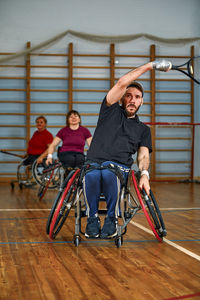 Side view of man riding bicycle