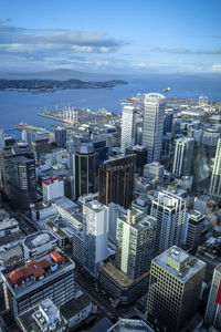 High angle view of modern buildings in city against sky