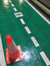 High angle view of arrow symbol on road in city