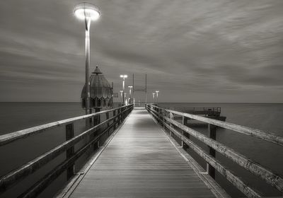 Pier over sea against sky