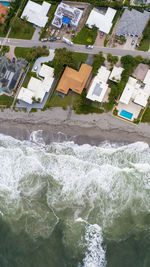 High angle view of sea and buildings