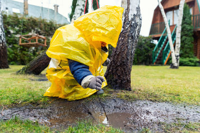 Full frame shot of wet yellow umbrella on rainy day