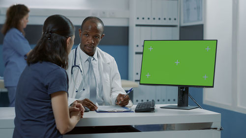 Doctor examining patient in clinic