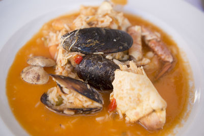 Close-up of seafood curry served in plate on table