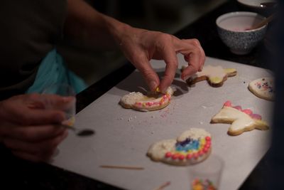 Midsection of person preparing food on table