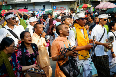 Group of people in town square