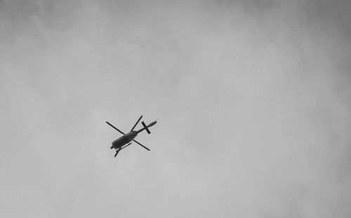 Low angle view of airplane flying in sky