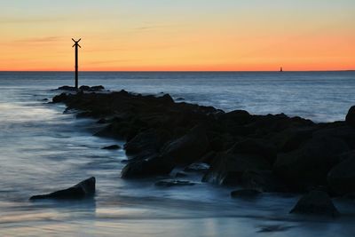 Scenic view of sea against sky during sunset