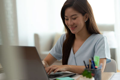 Young woman using mobile phone