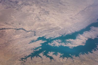 High angle view of land against cloudy sky