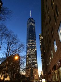 Low angle view of modern building against sky at night