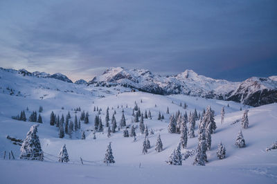 Scenic view of snow covered mountains against sky