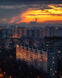 High angle view of illuminated buildings against sky during sunset