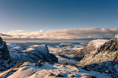 Scenic view of snowcapped mountains against sky during winter