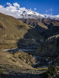 Scenic view of landscape and mountains against sky