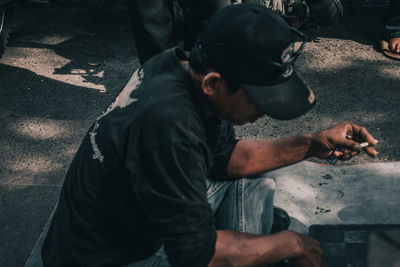 High angle view of man working on street