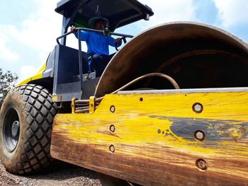 Rear view of a high angle view of yellow wheel