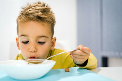 Portrait of boy eating food