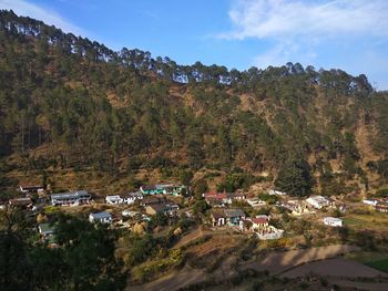 High angle view of trees and houses against sky