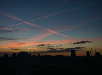 Silhouette of city during sunset