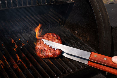 High angle view of meat on barbecue grill