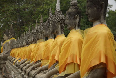 Buddha statues in row at wat yai chai mongkhon