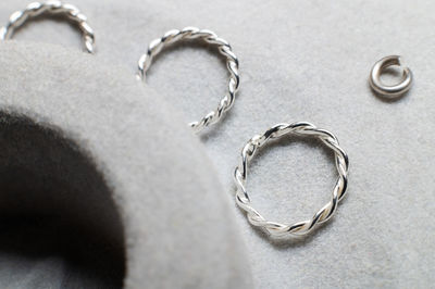 Close-up of wedding rings on table