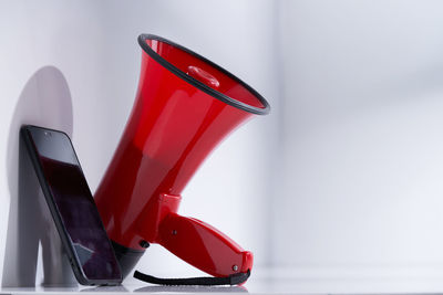 Close-up of red shoes on table