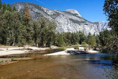 Scenic view of waterfall against sky
