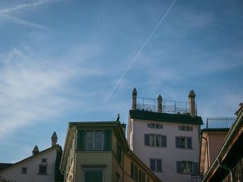 Low angle view of buildings against blue sky