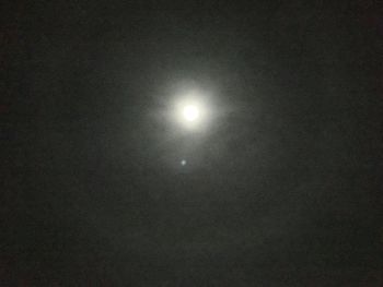 Low angle view of moon against sky at night