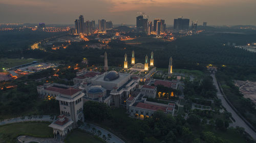 High angle view of illuminated buildings in city