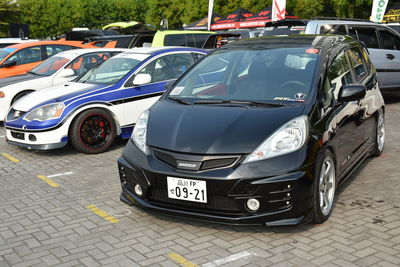 Cars parked on street in city