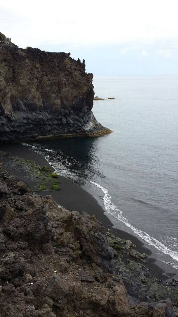 sea, water, horizon over water, tranquil scene, scenics, rock formation, tranquility, beauty in nature, rock - object, rock, nature, sky, cliff, beach, idyllic, shore, coastline, geology, rocky, mountain