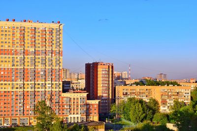 High angle view of cityscape against blue sky