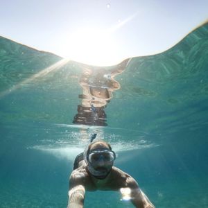 Portrait of man swimming in sea