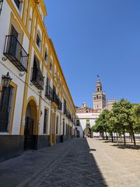 View of buildings in city against clear sky