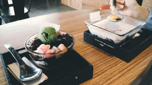 High angle view of dessert in glass bowl on table