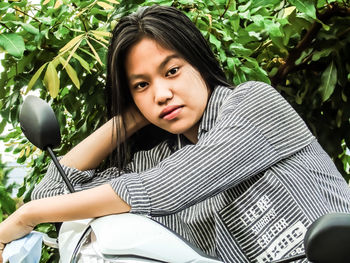 Portrait of girl sitting outdoors