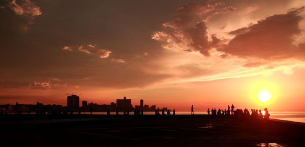 Silhouette of city at sunset