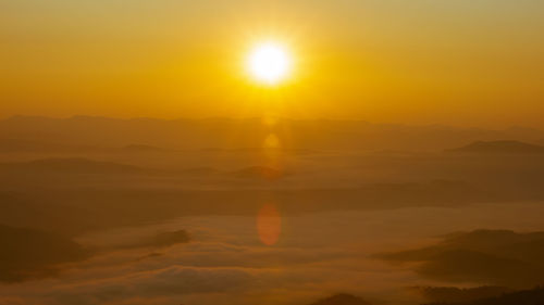 Scenic view of silhouette mountain against romantic sky at sunset