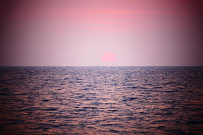 Scenic view of sea against clear sky during sunset