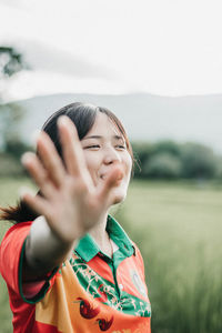 Portrait of smiling woman on field