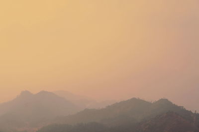 Scenic view of mountains against sky during sunset