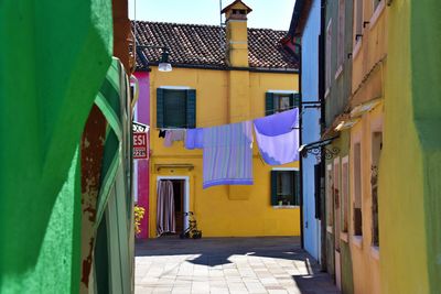 Narrow alley amidst buildings in city