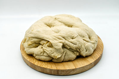 High angle view of bread on table against white background